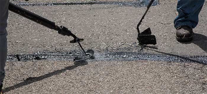 Photograph of crack sealing on roadway