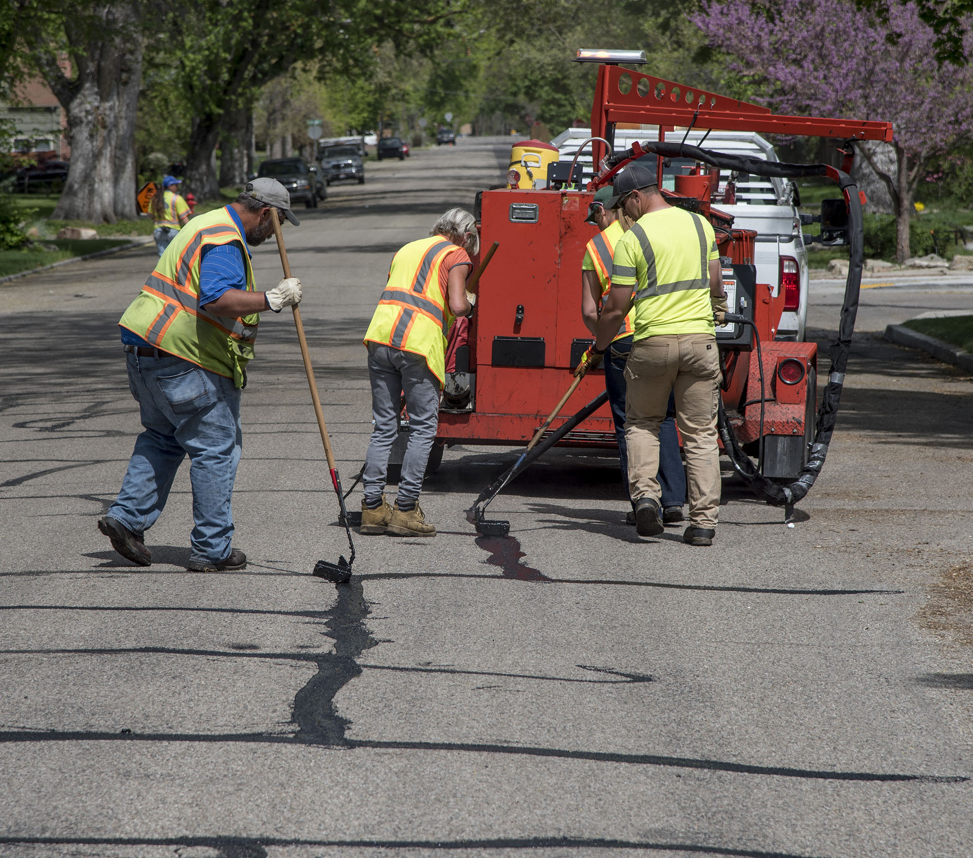 Photograph of  team crack sealing on roadway