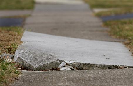 Photograph of heaving sidewalk hazard