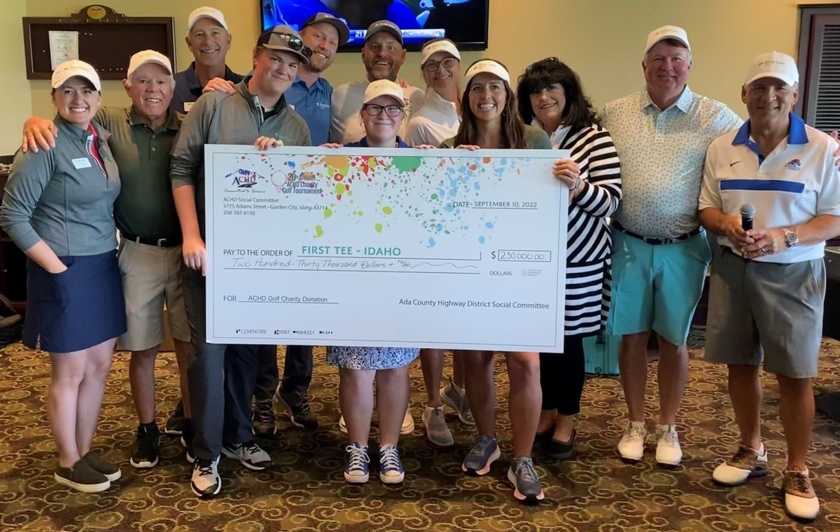 Image of First Tee Golf Tournament check and staff in jpg