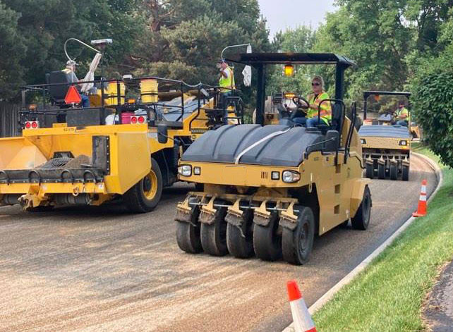 Photograph rollers on newly chip sealed road in jpg