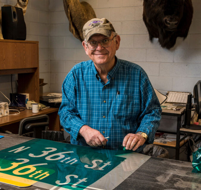 Photograph of Ron Spurl in sign shop in jpg