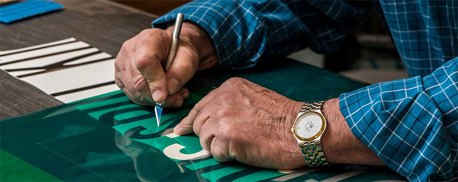 Photograph of hands creating a sign in jpg