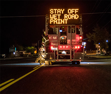 Photograph of paint truck wet paint sign