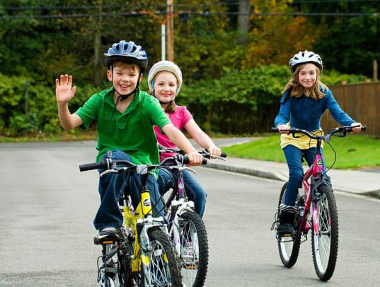 Photograph of kids on bicycles