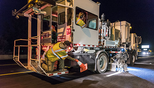 Photograph of Paint Truck and Crew at night